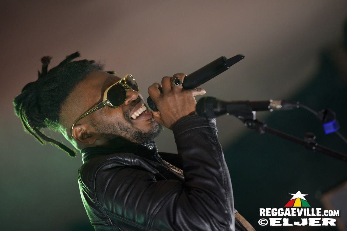 Anthony Locks singing live into a handheld microphone